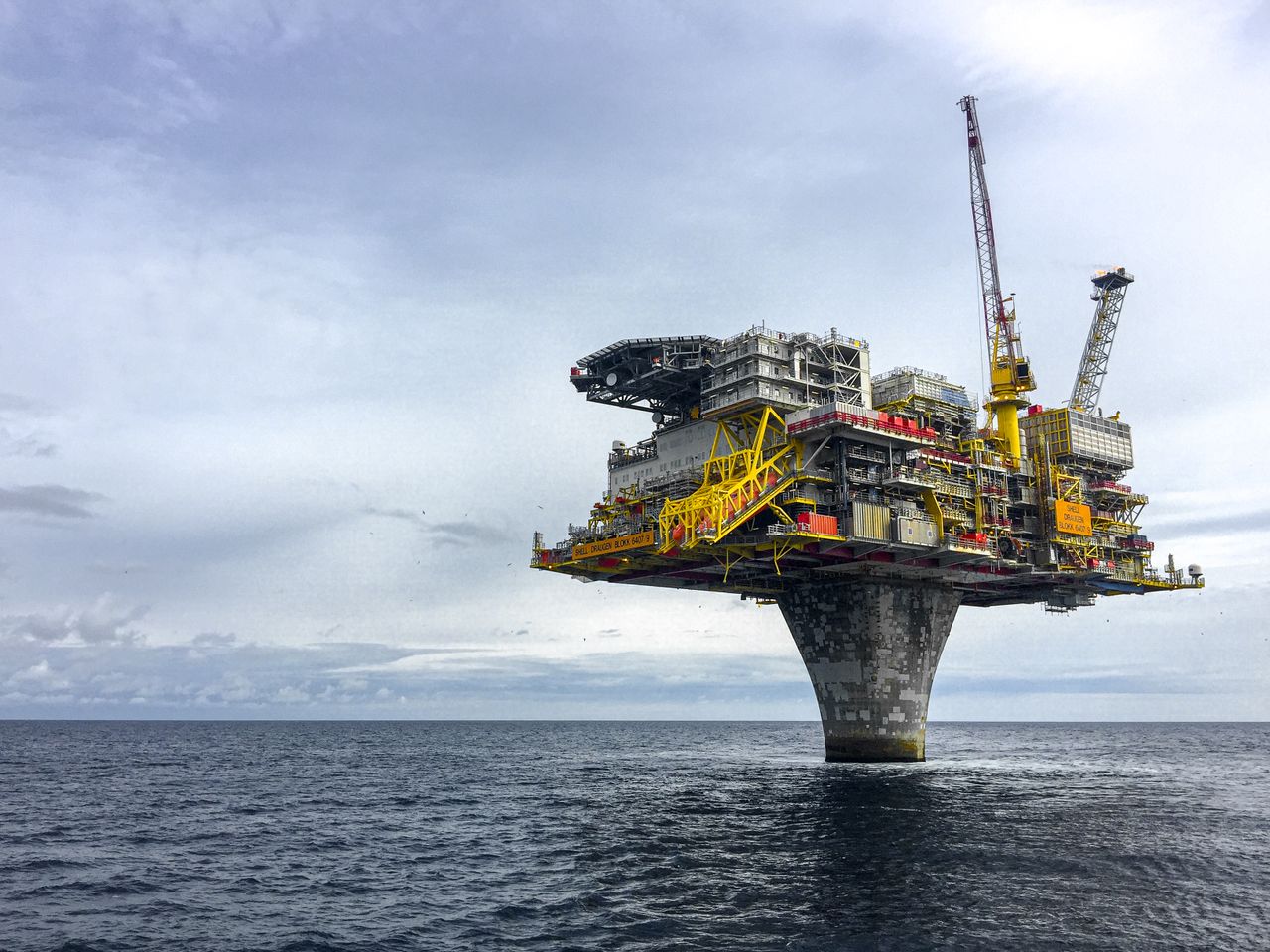 Dramatic view of a large oil platform in Norways North Sea, symbolizing offshore industry.